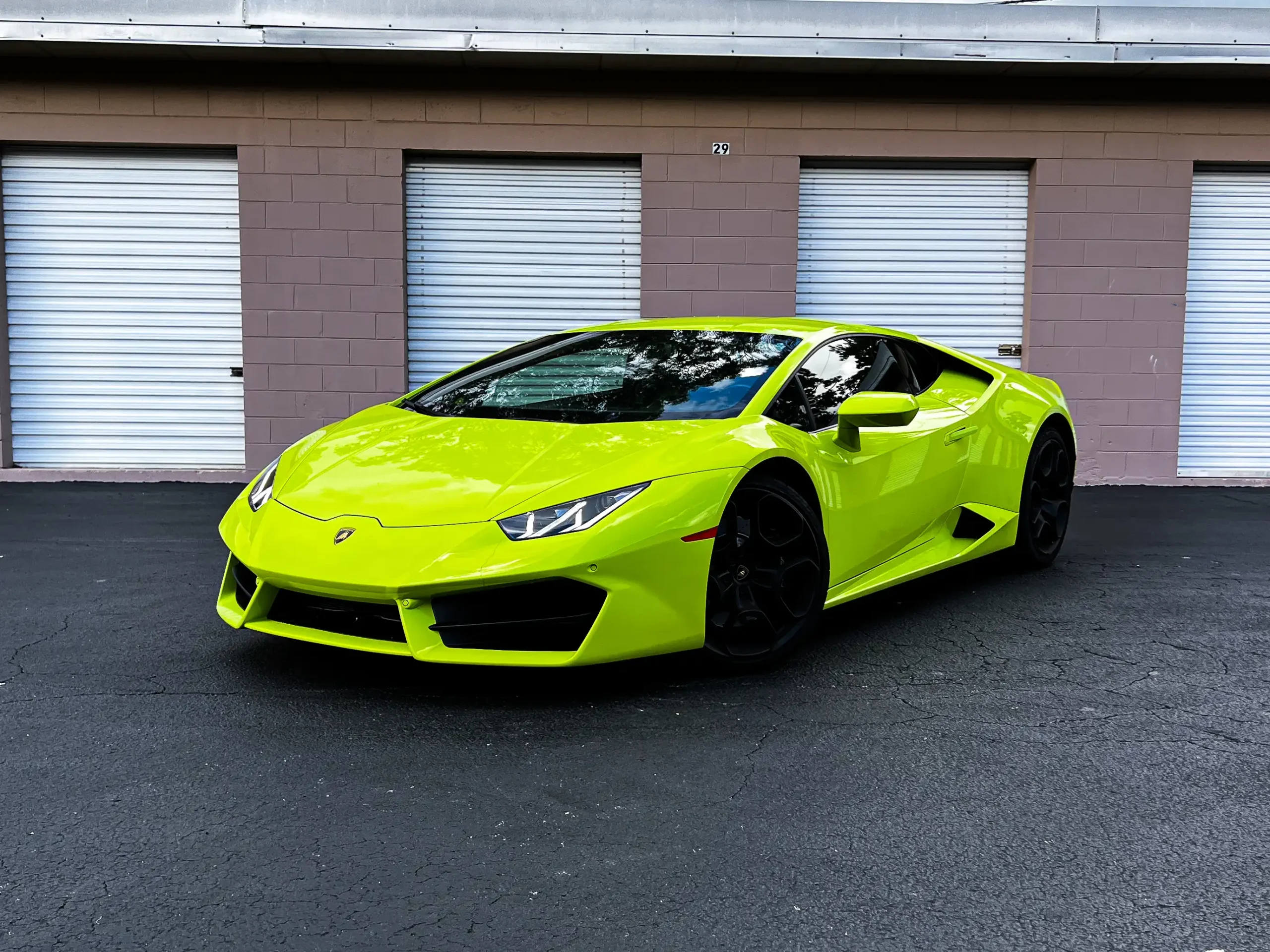 Green Lamborghini Huracán exotic rental car in Orlando